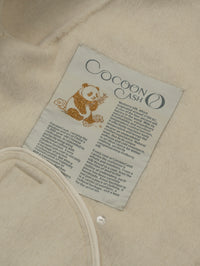 Wool coat with Lotus Bloom Clasp